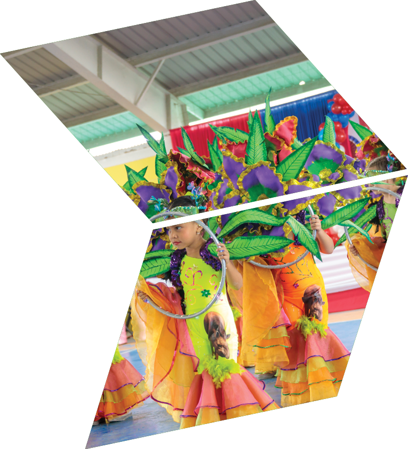 A group of people wearing colorful outfits and dancing on a basketball court. Description generated by AI