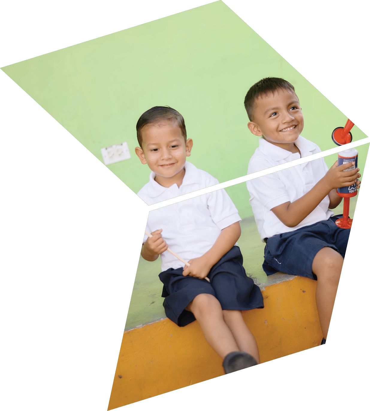 Two children sitting on a bench. Description generated by AI